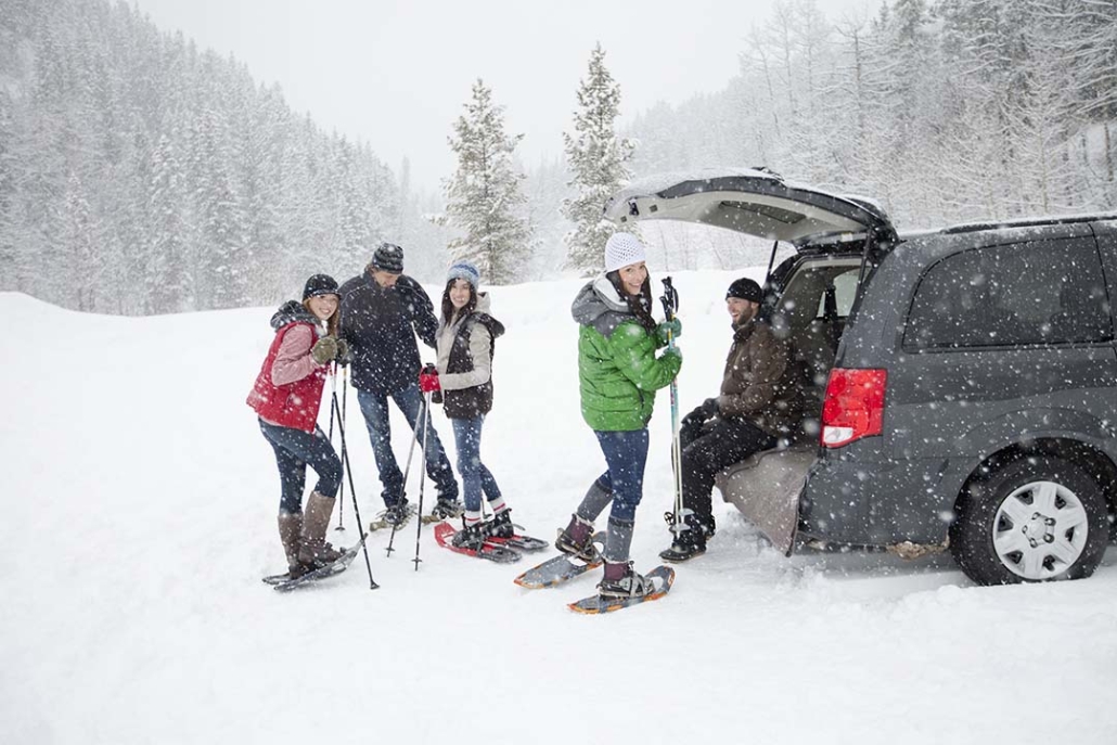 snowshoeing family at the car