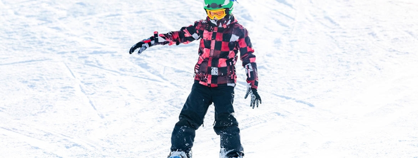 Boy Having Fun, Snowboarding in the Mountains