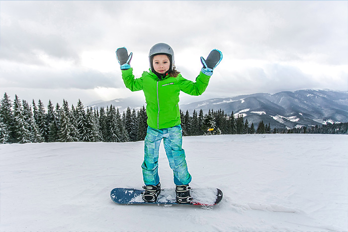 excited snowboarding kid