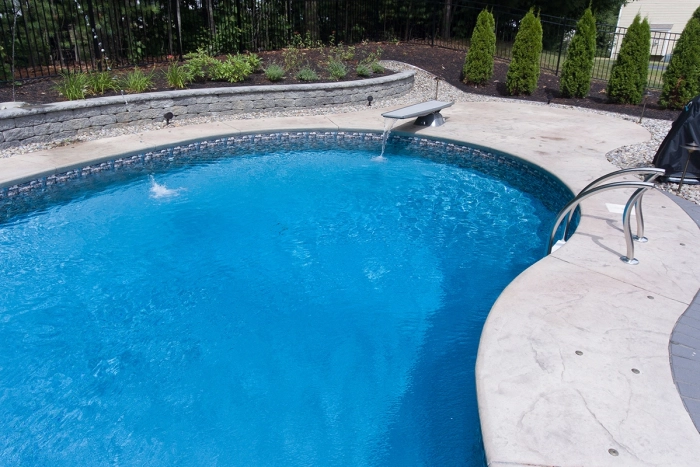 in ground pool with diving board